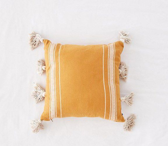 Introduce a hint of autumn color with this fringe throw pillow